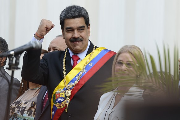 Venezuela&#039;s President Nicolas Maduro, waves as he arrives at the National Constituent Assembly&#039;s building during the celebration rally of the 20th anniversary of the Venezuelan Constitution  ...