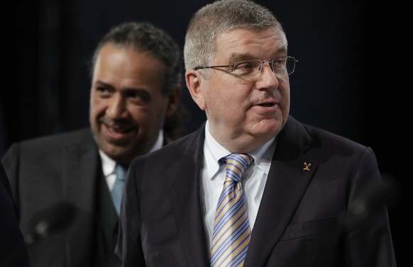 ANOC president Sheikh Ahmad Al Fahad Al Sabah of Kuwait, left, and IOC President Thomas Bach, right, arrive at the general assembly of The Association of National Olympic Committees in Prague, Czech R ...