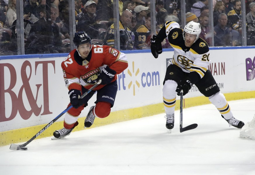 Florida Panthers&#039; Denis Malgin (62) skates with the puck as Boston Bruins&#039; Riley Nash (20) defends during the first period of an NHL hockey game, Thursday, March 15, 2018, in Sunrise, Fla. ( ...