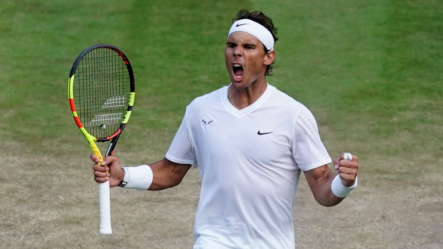 epa07708579 Rafael Nadal of Spain celebrates winning against Sam Querrey of the USA in their quarter final match during the Wimbledon Championships at the All England Lawn Tennis Club, in London, Brit ...