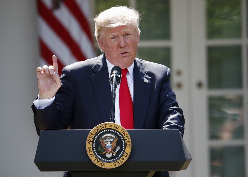 FILE - In this Thursday, June 1, 2017 file photo, President Donald Trump speaks about the U.S. role in the Paris climate change accord in the Rose Garden of the White House in Washington. Trump promis ...