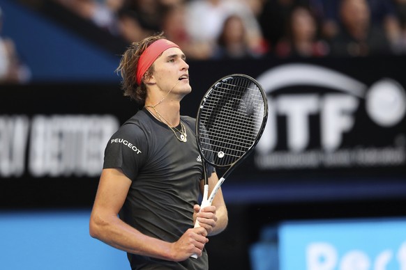 Alexander Zverev of Germany reacts after missing a shot during his match against Switzerland&#039;s Roger Federer in the final of the Hopman Cup tennis tournament in Perth, Australia, Saturday Jan. 5, ...