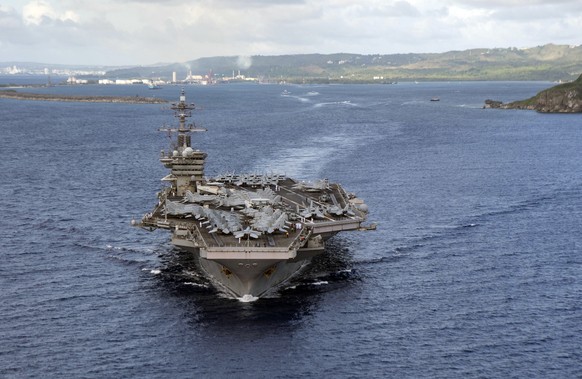 PHILIPPINE SEA (June 4, 2020)In this June 4, 2020, photo provided by the U.S. Navy, the aircraft carrier USS Theodore Roosevelt (CVN 71) departs Apra Harbor in Guam. The carrier has returned to sea an ...