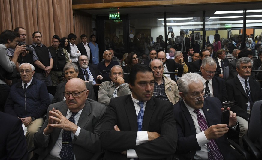 epa06358393 The ex-military Jorge Eduardo Acosta (second row-L) and Alfredo Astiz (second row-2-L) listen to the reading of the verdict, at the federal courts of Buenos Aires, Argentina, 29 November 2 ...