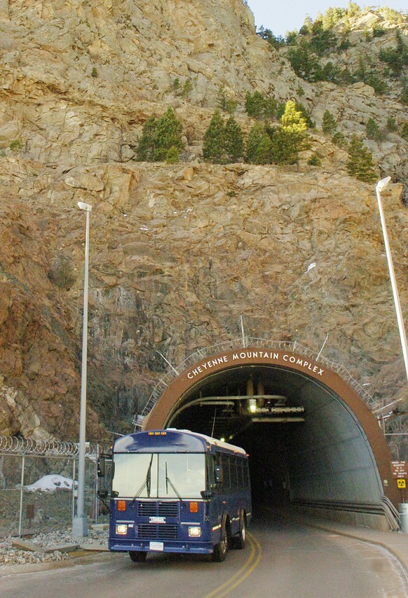 A bus exits the NORAD Cheyenne Mountain Complex, on Cheyenne Mountain, seen Jan. 18, 2006. The North American Aerospace Defense Command is expected to announce Friday July 28, 2006 The military is vir ...