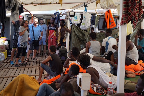 epa07781139 Lampedusa&#039;s Mayor Salvatore Martello (3-L) visits the Spanish rescue ship Open Arms, which carries 107 migrants that remain on board after 18 days at sea off Lampedusa, Italy, 19 Augu ...