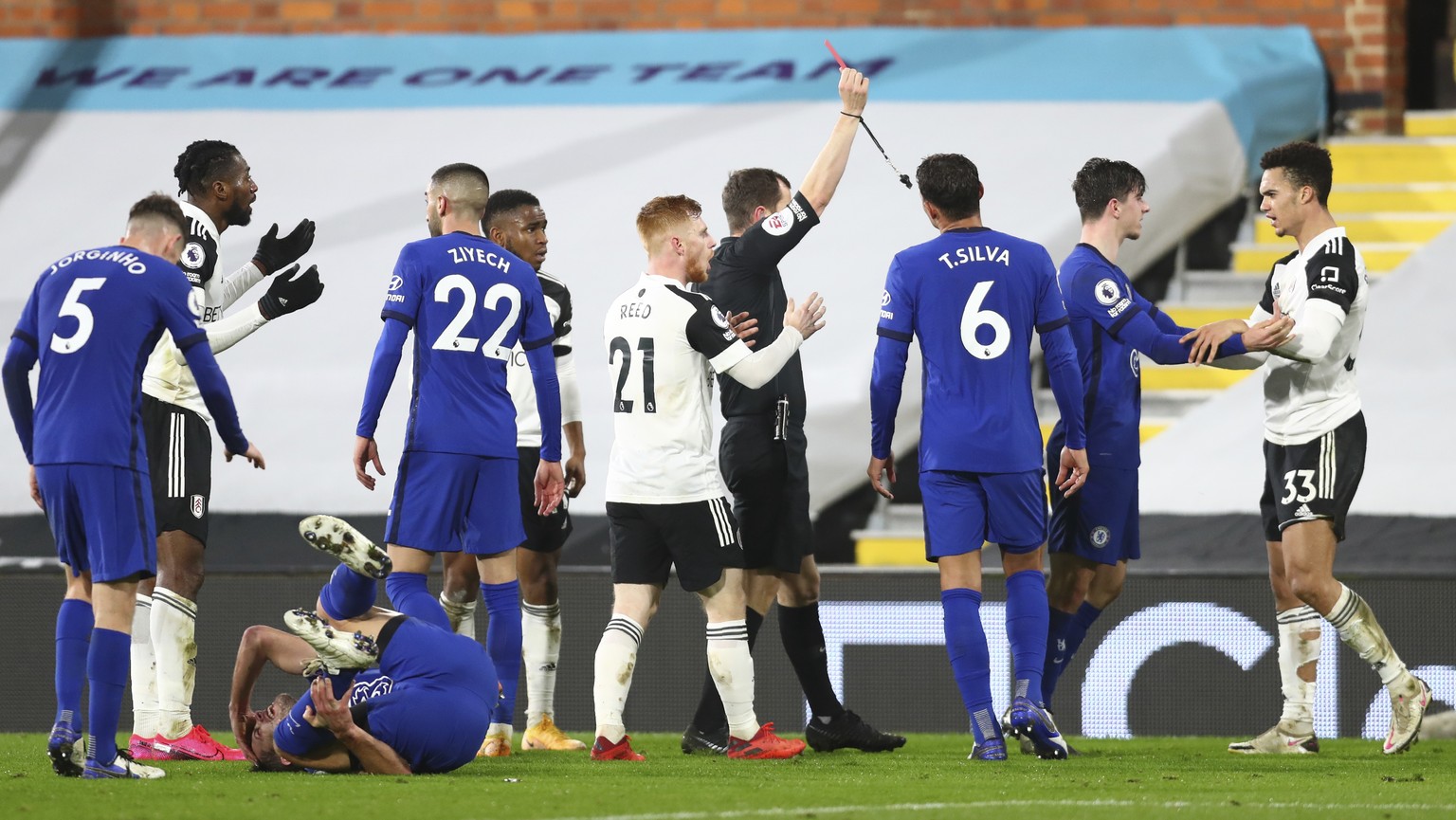 Fulham&#039;s Antonee Robinson is shown a red card by referee Peter Bankes during the English Premier League soccer match between Fulham and Chelsea at Craven Cottage in London, England, Saturday, Jan ...