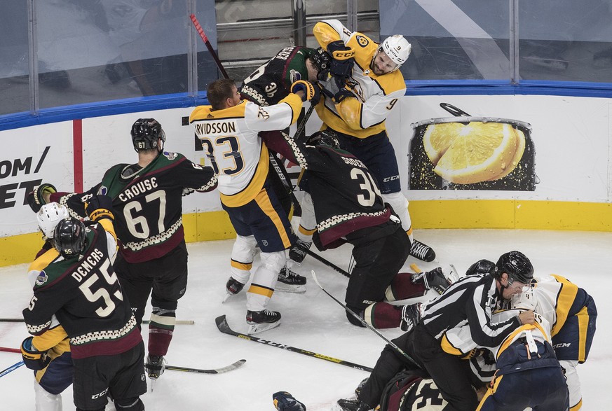 The Nashville Predators and the Arizona Coyotes get in a line brawl during third period NHL qualifying round game action in Edmonton, on Wednesday, Aug. 5, 2020. (Jason Franson/The Canadian Press via  ...