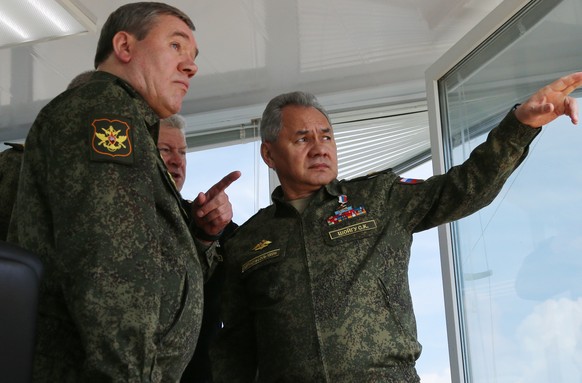 epa09152961 A handout photo made available by the press service of the Russian Defence Ministry shows Russian Defense Minister Army General Sergei Shoigu (R) and Chief of the Russian General Staff Val ...