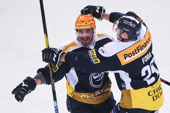 Ambri&#039;s player Matt D&#039;Agostini, left, celebrates the 3-0 goal with Ambri&#039;s player Michael Fora, right, during the preliminary round game of National League A (NLA) Swiss Championship 20 ...