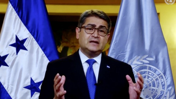 In this image made from UNTV video, Juan Orlando Hernández Alvarado, President of Honduras, speaks in a pre-recorded message which was played during the 75th session of the United Nations General Asse ...