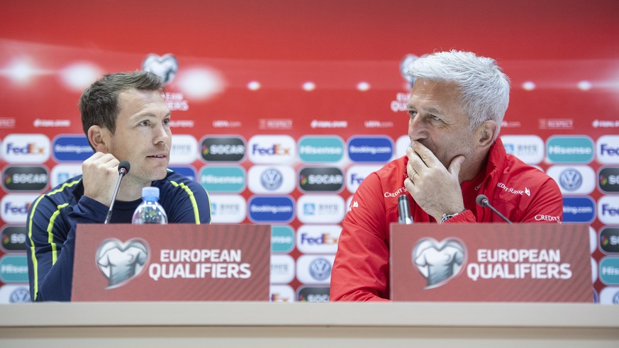 epa07456114 Switzerland&#039;s head coach Vladimir Petkovic (L) and Switzerland&#039;s Stephan Lichtsteiner attend a press conference at the Boris Paitchadze Dinamo Arena in Tbilisi, Georgia, Friday,  ...