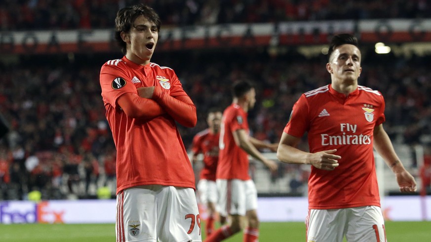Benfica&#039;s Joao Felix, center, celebrates after scoring his side&#039;s second goal during the Europa League quarterfinals, first leg, soccer match between Benfica and Eintracht Frankfurt at the L ...