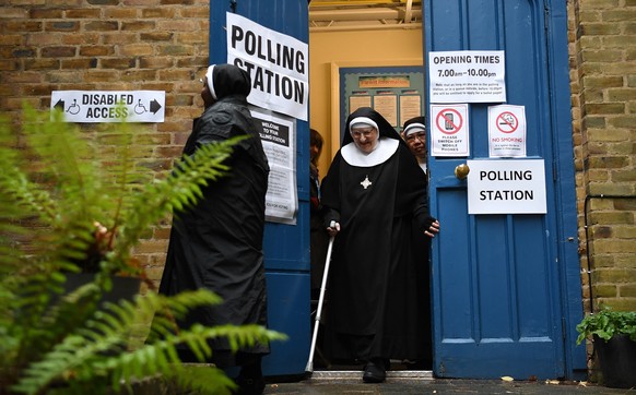 epa08065261 Nuns from the Tyburn Convent departs St. Johns church after voting during the general election in London, Britain, 12 December 2019. Britons go to the polls on 12 December 2019 in a genera ...