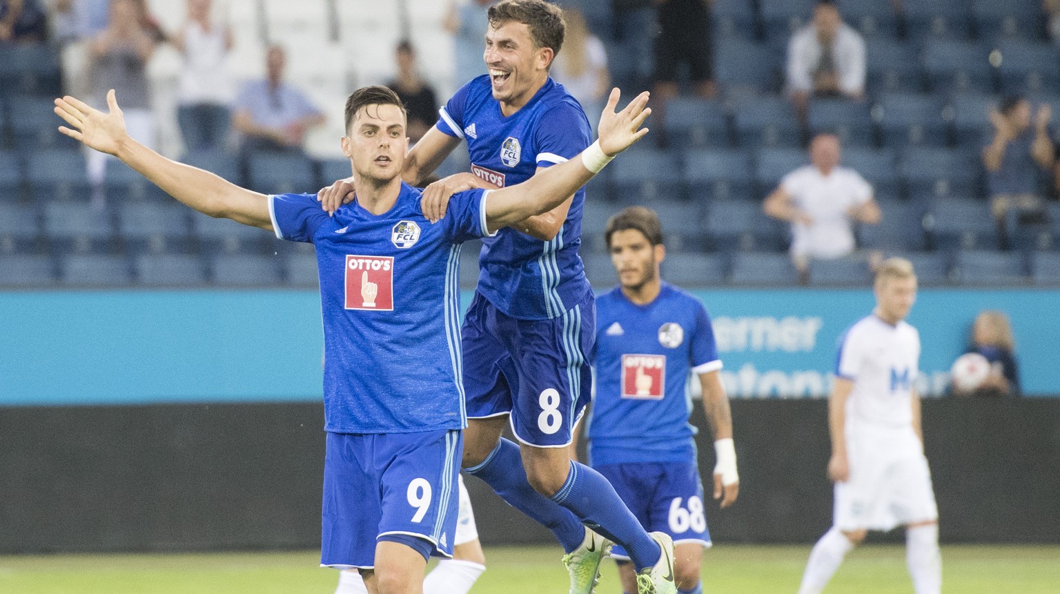 Tomi Juric, left, and Olivier Custodio, centre, from Luzern celebrate the Goal to the 2:0 during the UEFA Europa League qualifying second round soccer match between Switzerland&#039;s FC Luzern and Cr ...