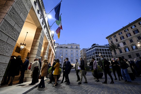 epa09166114 People stand in line outside the theater before a concert at the Opera House in Rome, Italy, 28 April 2021. The Teatro dell&#039;Opera di Roma reopened its doors to the public on 28 April  ...