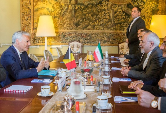epa06738483 Iranian Minister of Foreign Affairs Mohammad Javad Zarif (R) and Belgian Minister of Foreign Affairs Didier Reynders (L) during their meeting at Egmont Palace in Brussels, Belgium, 15 May  ...