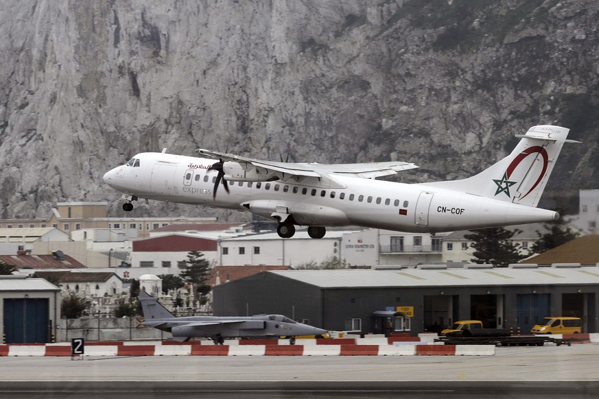 epa04170323 An ATR-72 600 plane of the Royal Air Maroc takes off from Gibraltar International Airport in Gibraltar, 17 April 2014. The Gibraltar-based &#039;Your Flight&#039; company on 17 April launc ...