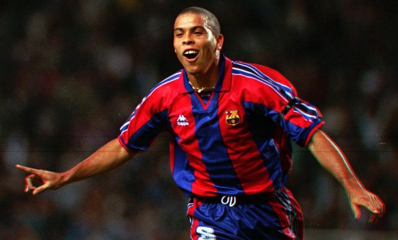 FILE - In this Sept. 12, 1996, file photo, F.C. Barcelona&#039;s Brazilian striker Ronaldo celebrates after scoring a goal during a Cup Winner&#039;s Cup 1st. round 1st leg soccer match against AEK La ...