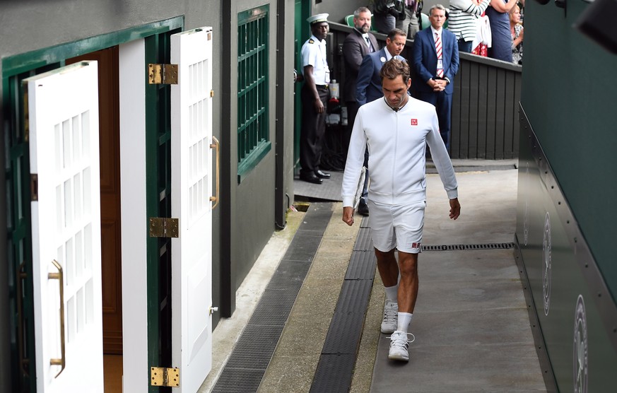 epa07717297 Roger Federer of Switzerland exits Centre Court after his loss to Novak Djokovic of Serbia in the men&#039;s final of the Wimbledon Championships at the All England Lawn Tennis Club, in Lo ...