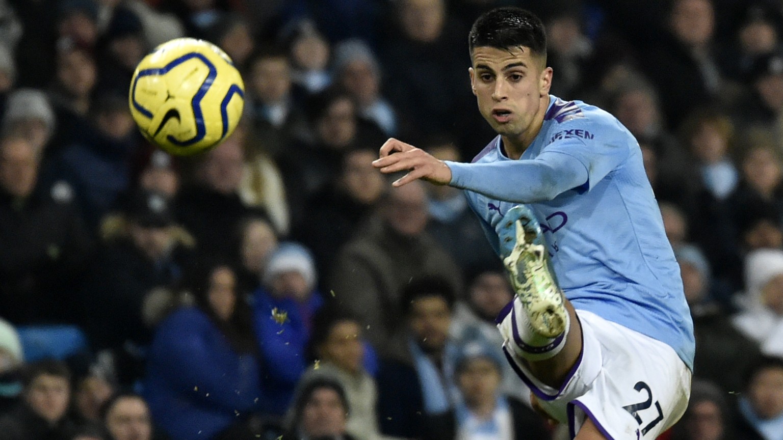 Manchester City&#039;s Joao Cancelo kicks the ball during the English Premier League soccer match between Manchester City and Everton at Etihad stadium in Manchester, England, Wednesday, Jan. 1, 2020. ...