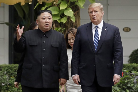 FILE - In this Feb. 28, 2019 file photo, U.S President Donald Trump, right, and North Korean leader Kim Jong Un take a walk after their first meeting at the Sofitel Legend Metropole Hanoi hotel, in Ha ...