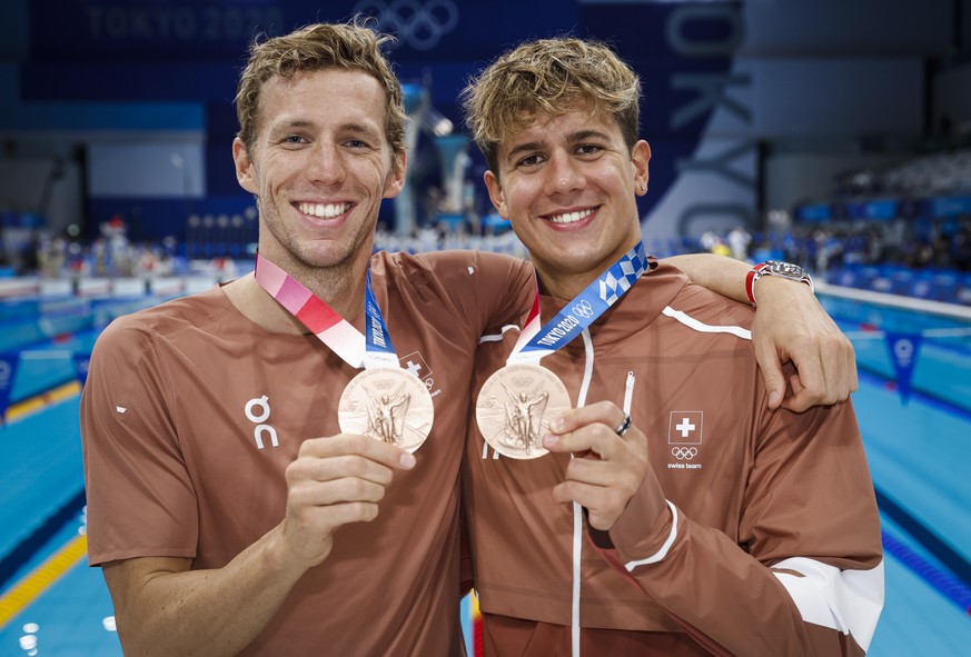 epa09382374 Noe Ponti (R) and Jeremy Desplanches of Switzerland pose with their Bronze medals after finishing third in the men&#039;s 100m Butterfly Final (Ponti) and in the men&#039;s 200m Individual ...