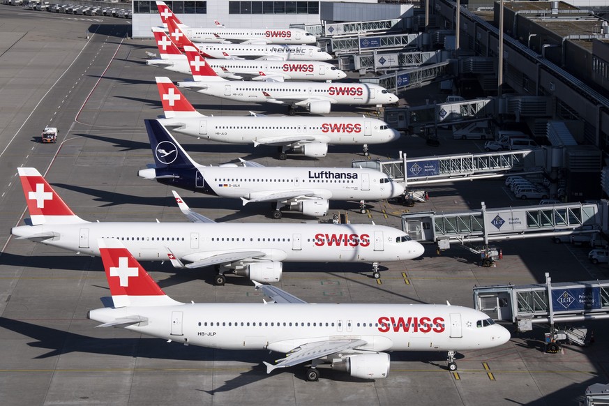 Parked planes of the airline Swiss at the airport in Zurich, Switzerland on Monday, 23 March 2020. The bigger part of the Swiss airplanes are not in use due to the outbreak of the coronavirus. (KEYSTO ...
