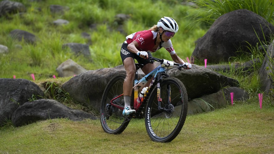 Jolanda Neff of Switzerland competes during the women&#039;s cross-country mountain bike competition at the 2020 Summer Olympics, Tuesday, July 27, 2021, in Izu, Japan. (AP Photo/Christophe Ena)
