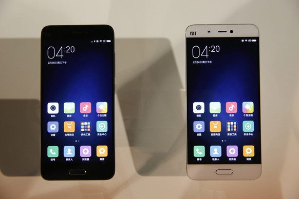 epa05178796 The new spartphone &#039;Xiaomi Mi 5&#039; on display, after Lei Jun (not pictured), CEO of Chinese mobile internet company Xiaomi Technology Co. Ltd., introduced the new smartphone at the ...