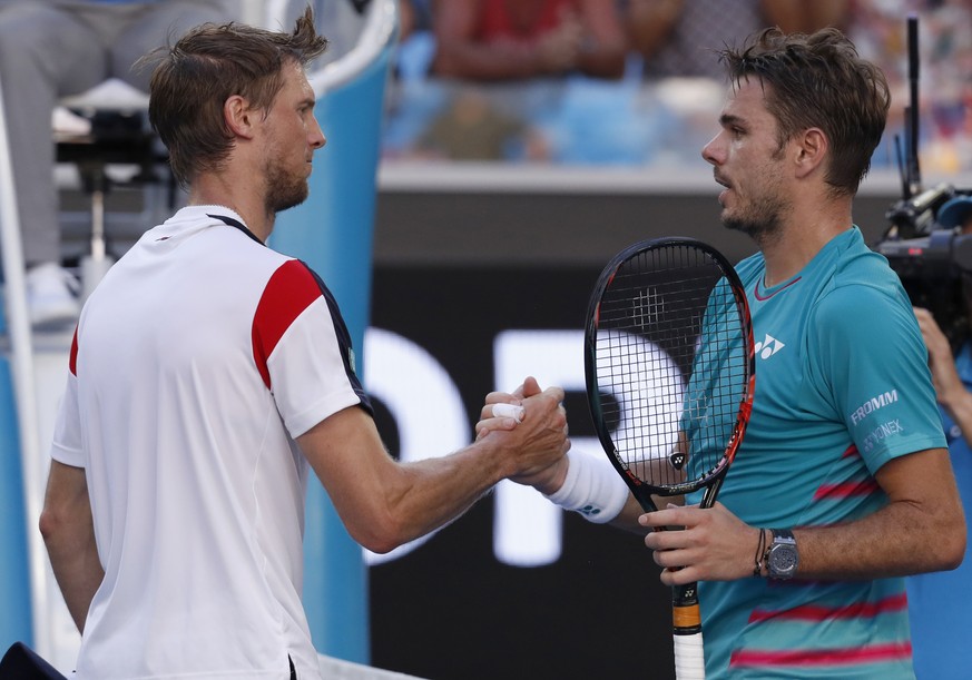 Switzerland&#039;s Stan Wawrinka, right, shakes hands with Italy&#039;s Andreas Seppi after Wawrinka won their fourth round match at the Australian Open tennis championships in Melbourne, Australia, S ...
