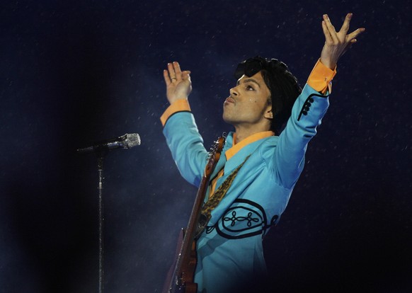 FILE- In this Feb. 4, 2007, file photo, Prince performs during the halftime show at Super Bowl XLI at Dolphin Stadium in Miami. On Friday, June 19, 2020, his