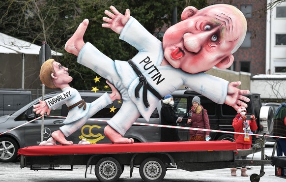 A political carnival float depicting Russia&#039;s President Vladimir Putin fighting with opposition Alexei Navalny is rolled out to be shown in the streets in Duesseldorf, Germany, Monday, Feb. 15, 2 ...