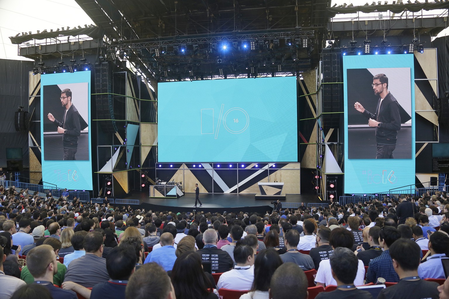 Google CEO Sundar Pichai walks on stage to deliver the keynote address of the Google I/O conference, Wednesday, May 18, 2016, in Mountain View, Calif. Google is unveiling its vision for phones, cars,  ...