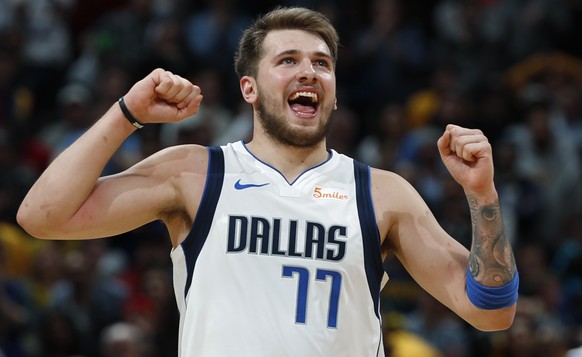 Dallas Mavericks forward Luka Doncic reacts after missing a foul shot late in the second half of the team&#039;s NBA basketball game against the Denver Nuggets on Thursday, March 14, 2019, in Denver.  ...