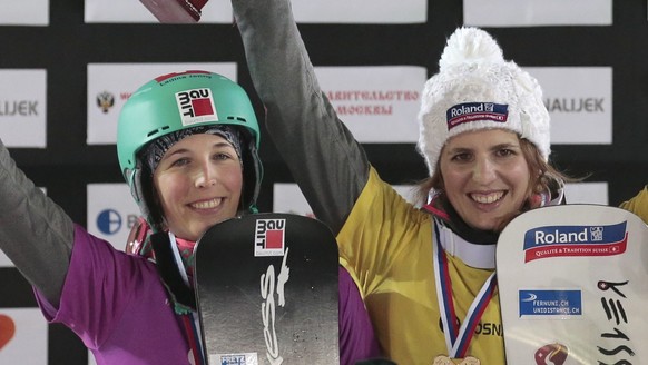 From left, Ladina Jenny, Patrizia Kummer, both of Switzerland, and Czech Republik&#039;s Ester Ledecka celebrate with their silver, gold and bronze medals after the women&#039;s parallel slalom at the ...
