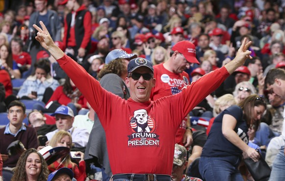 epa07972693 A supporter of US President Donald J. Trump poses during a campaign rally at Rupp Arena in Lexington, Kentucky, USA, 04 November 2019. Trump was holding a campaign rally in support of Kent ...