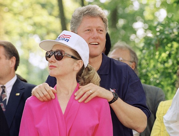 FILE - In this July 21, 1992 file photo, then-Democratic presidential nominee Bill Clinton stands with his wife Hillary Clinton during a campaign stop at General Butler State Park in Carrollton, Ky. B ...