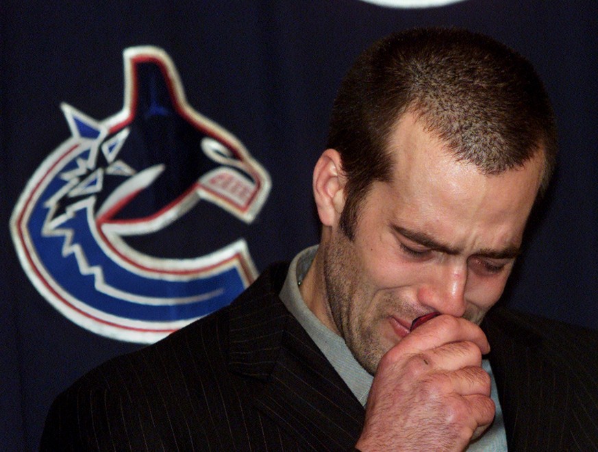 Vancouver Canucks&#039; Todd Bertuzzi has tears as he apologizes for sucker-punching Steve Moore of the Colorado Avalance during an NHL game Monday night while speaking with the media briefly at GM Pl ...