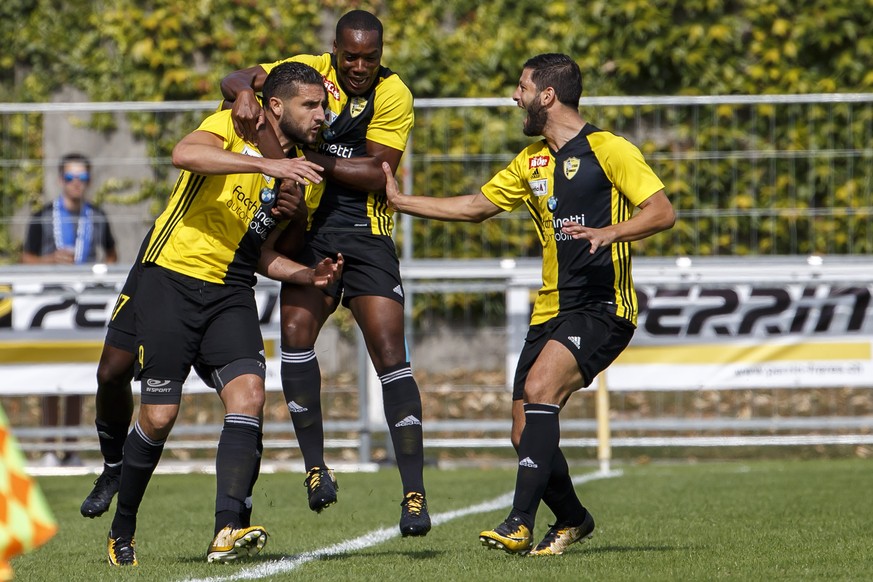 Stade Nyonnais&#039; forward Karim Chentouf, left, celebrates his goal with teammates forward Ridge Mobulu, centre, and defender Fabrice Guzel, right, after scoring the 1:0, during the Swiss Cup Round ...