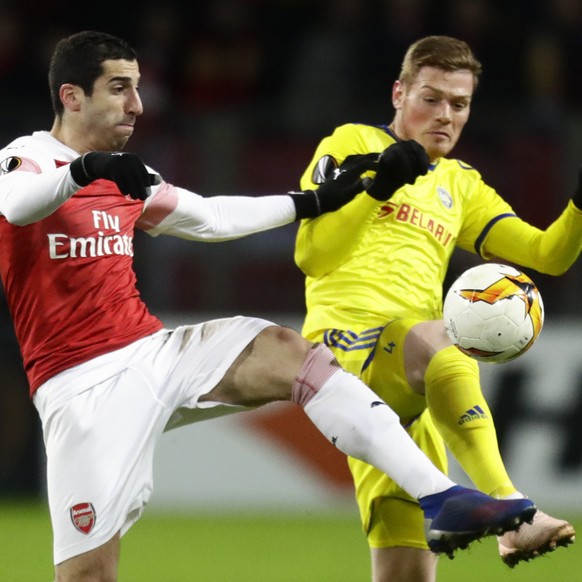 FILE - In this Thursday, Feb. 14, 2019 file photo Arsenal&#039;s Henrikh Mkhitaryan, left, duels for the ball with Bate&#039;s Aleksandar Filipovic during the Europa League round of 32 first leg socce ...