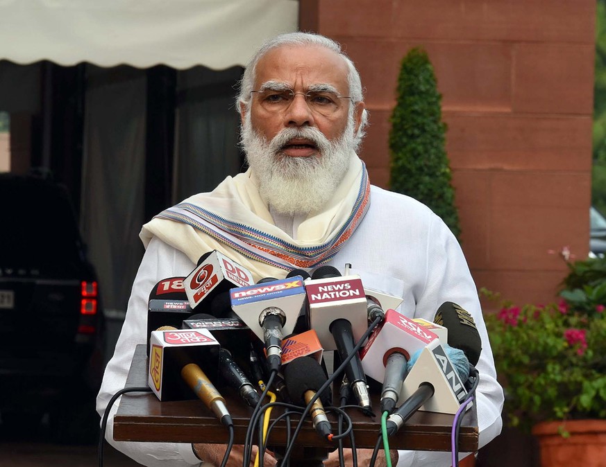 epa08667752 A handout picture made available by the Indian Press Information Bureau (PIB) on 14 September 2020 shows Indian Prime Minister Narendra Modi addressing the Media at the beginning of the mo ...