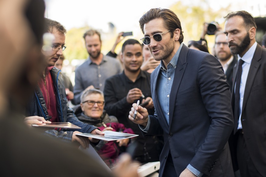 American actor Jake Gyllenhaal gives autographs after the press conference for his movie &quot;Stronger&quot; at the 13th Zurich Film Festival in Zurich, Switzerland, Tuesday, Oct. 3, 2017. The festiv ...