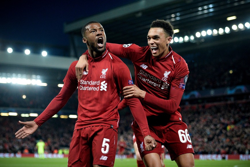 epa07554593 Liverpool&#039;s Georginio Wijnaldum (L) celebrates with his teammate Trent Alexander-Arnold (R) after scoring the 3-0 goal during the UEFA Champions League semi final second leg soccer ma ...
