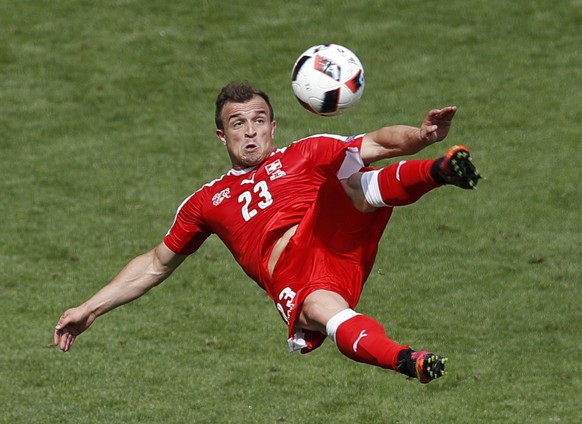 Switzerland&#039;s Xherdan Shaqiri scores on an acrobatic kick during the Euro 2016 round of 16 soccer match between Switzerland and Poland, at the Geoffroy Guichard stadium in Saint-Etienne, France,  ...