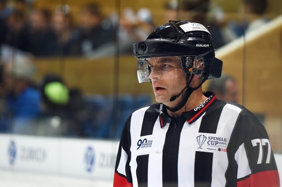 Headreferee Tobias Wehrli with a helmetcamera for the tv during the game between Switzerland&#039;s HC Lugano and Avtomobilist Yekaterinburg at the 90th Spengler Cup ice hockey tournament in Davos, Sw ...