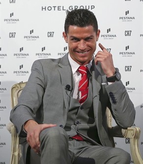 epa05073208 Real Madrid&#039;s Portuguese striker Cristiano Ronaldo smiles during the presentation of an agreement with the Pestana Hotel Group, planning to build four hotels, at Pestana Palace Hotel  ...