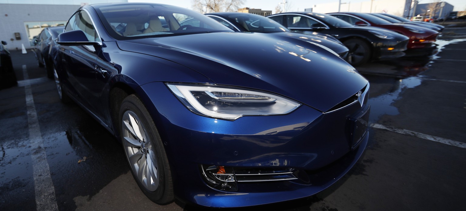 FILE - In this Sunday, Feb. 3, 2019, file photograph, an unsold 2019 S75D sits at a Tesla dealership in Littleton, Colo. Tesla&#039;s assembly lines slowed down during a rocky start to the new year, w ...