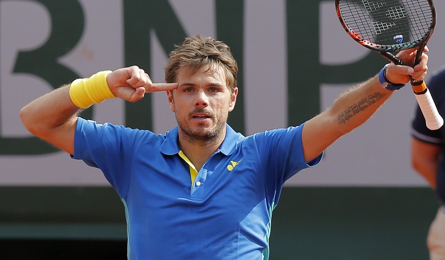 Switzerland&#039;s Stan Wawrinka celebrates winning his fourth round match of the French Open tennis tournament against France&#039;s Gael Monfils in three sets 7-5, 7-6 (9-7), 6-2, at the Roland Garr ...