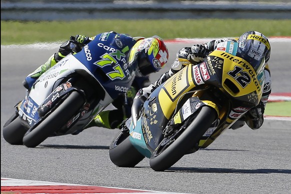 Switzerland&#039;s riders Thomas Luthi, right, and Dominique Aegerter steer their Suter during the San Marino Moto2 grand prix at the Misano circuit, in Misano Adriatico, Italy, Sunday, Sept. 14, 2014 ...